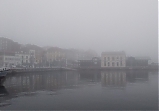 Gijón en la niebla