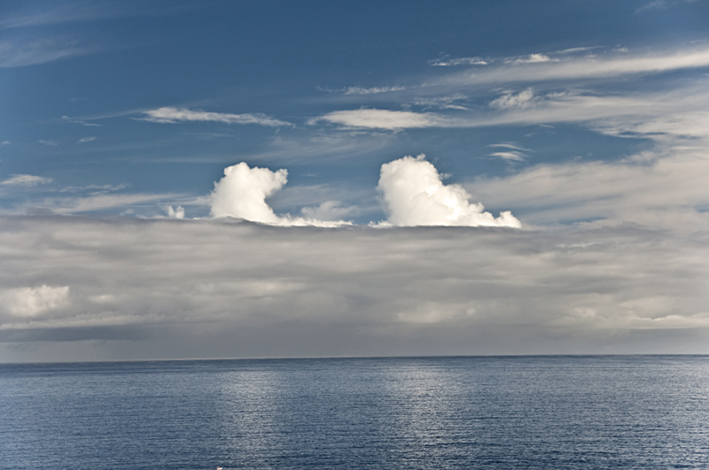 "Floating Lonely"
We were experiencing a few days of a certain instability where the clouds where dancing around constantly and restlessly. On one of these days, these two clouds were floating solitarily for a couple of minutes, reflected by the sea, just opposite the Canarian island’s coastline, offering us agreeable moments of tranquillity on La Palma.
Álbumes del atlas: ZEPM